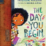 "The Day You Begin", by Jacqueline Woodson. Image of a brown skinned childe with dark curly hair coming through a doorway with a purple book. Colorful, decorative designs erupt from the book and surround the book title.
