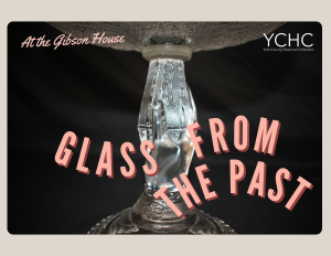 Close up of a pressed glass serving dish with a hand molded into the base. Reads: At the Gibson House Glass from the past"
